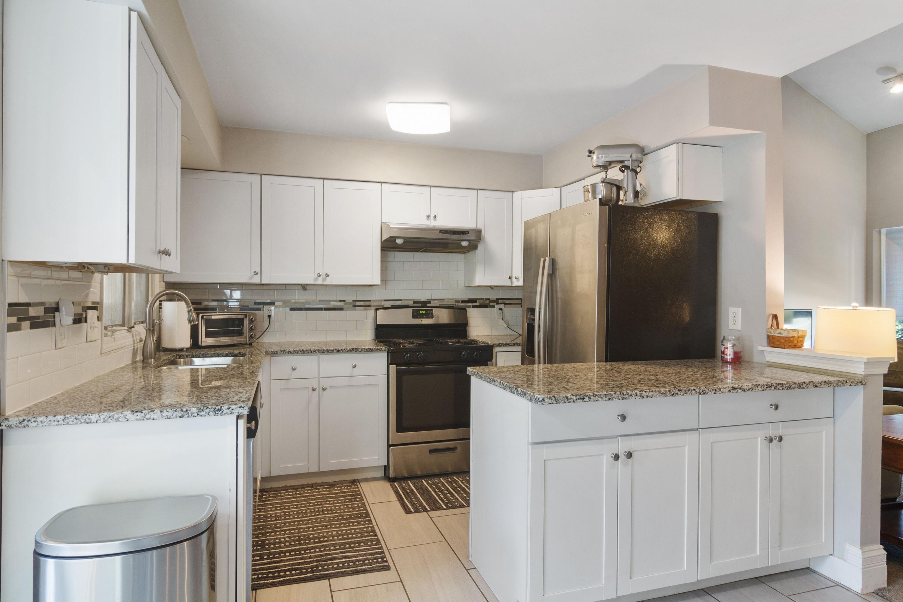 1847 Springvale Drive Crown Point, IN 46307 - Photo 8 of 22 a kitchen with a sink a stove and refrigerator
