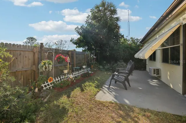 a view of a chairs and table in the patio