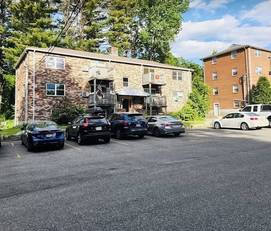 a view of a cars parked in front of a house