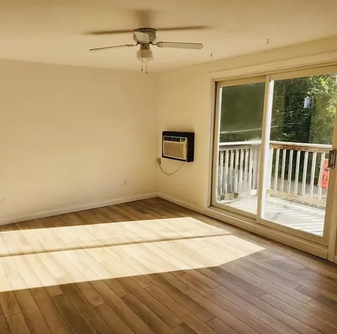 a view of balcony with wooden floor