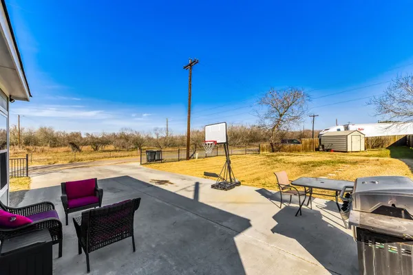 a view of a patio with swimming pool