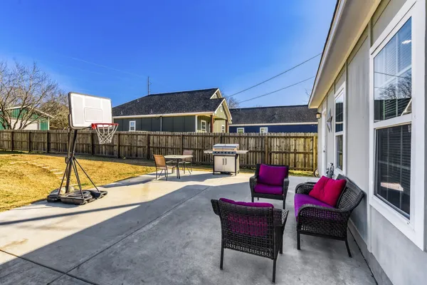 a swimming pool with outdoor seating