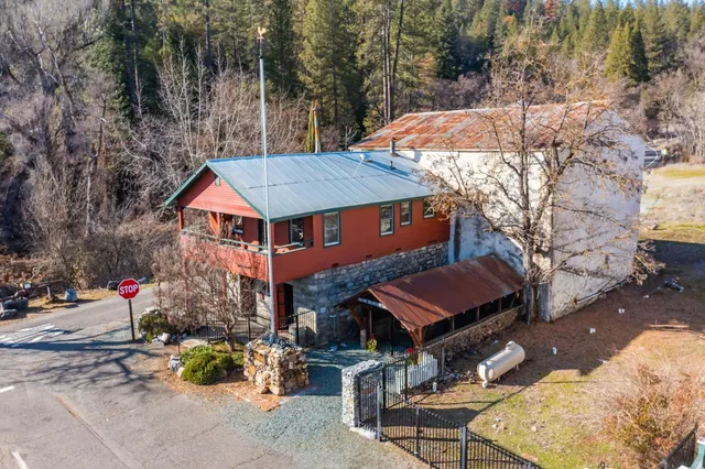 a group of people sitting in front of a building