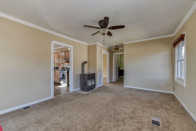 a kitchen with stainless steel appliances granite countertop a stove sink and cabinets