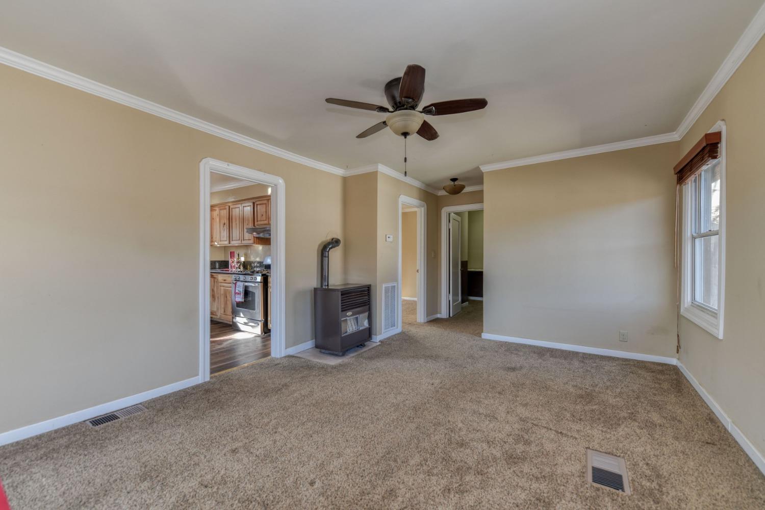 21335 Consolation Street Volcano, CA 95689 - Photo 19 of 41 a view of a livingroom with a ceiling fan and window
