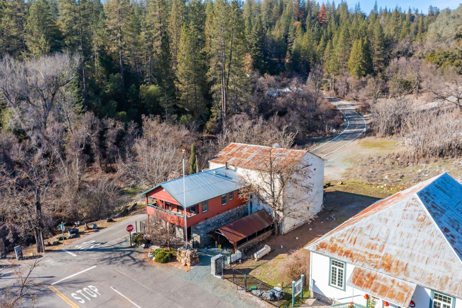 21335 Consolation Street Volcano, CA 95689 - Photo 39 of 41 a view of a patio with a table and chairs under an umbrella