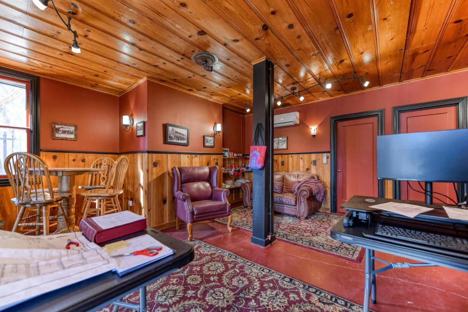 21335 Consolation Street Volcano, CA 95689 - Photo 9 of 41 a living room with lots of furniture and a lamp