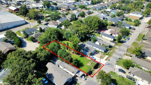 an aerial view of a house with a yard and garden