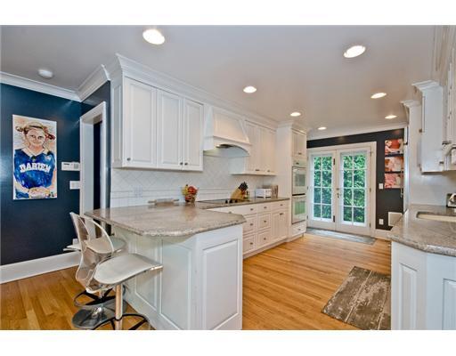 593 Hollow Tree Ridge Road Darien, CT 06820 - Photo 12 of 20 a kitchen with a sink cabinets and wooden floor