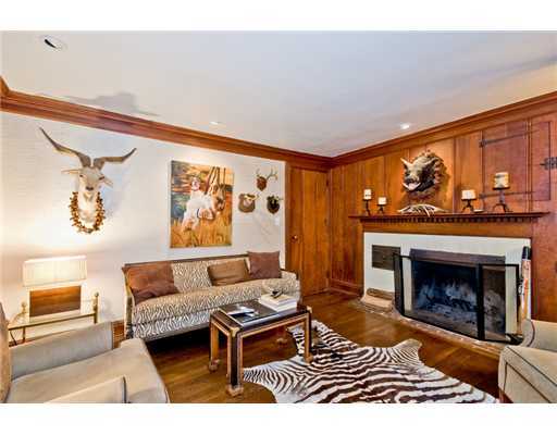 593 Hollow Tree Ridge Road Darien, CT 06820 - Photo 10 of 20 a living room with furniture and a fireplace
