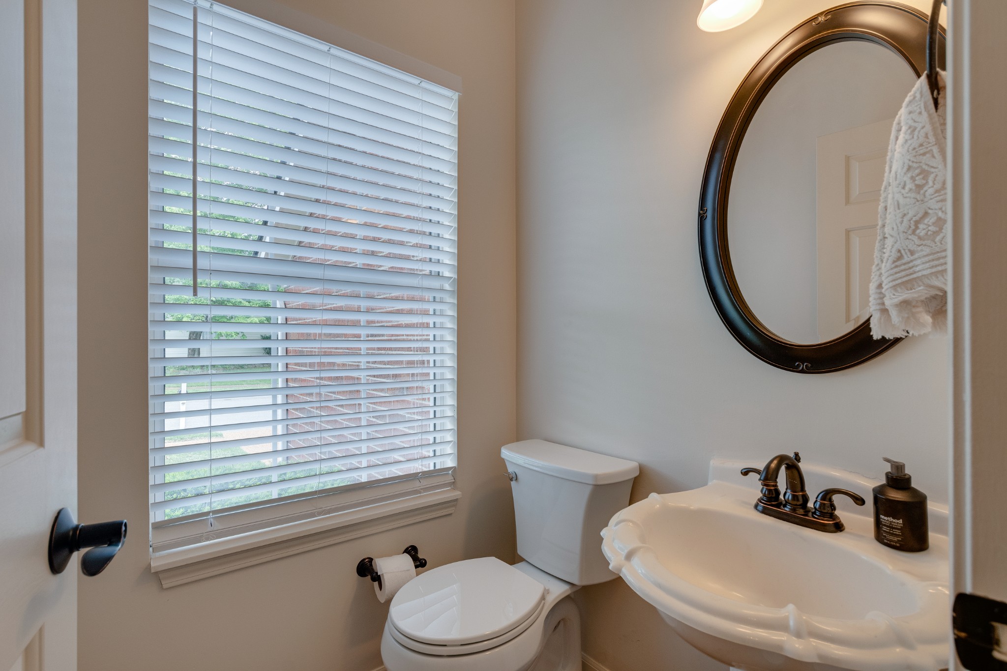 136 Cavalcade Circle Franklin, TN 37069 - Photo 12 of 31 a bathroom with a sink a toilet and a mirror