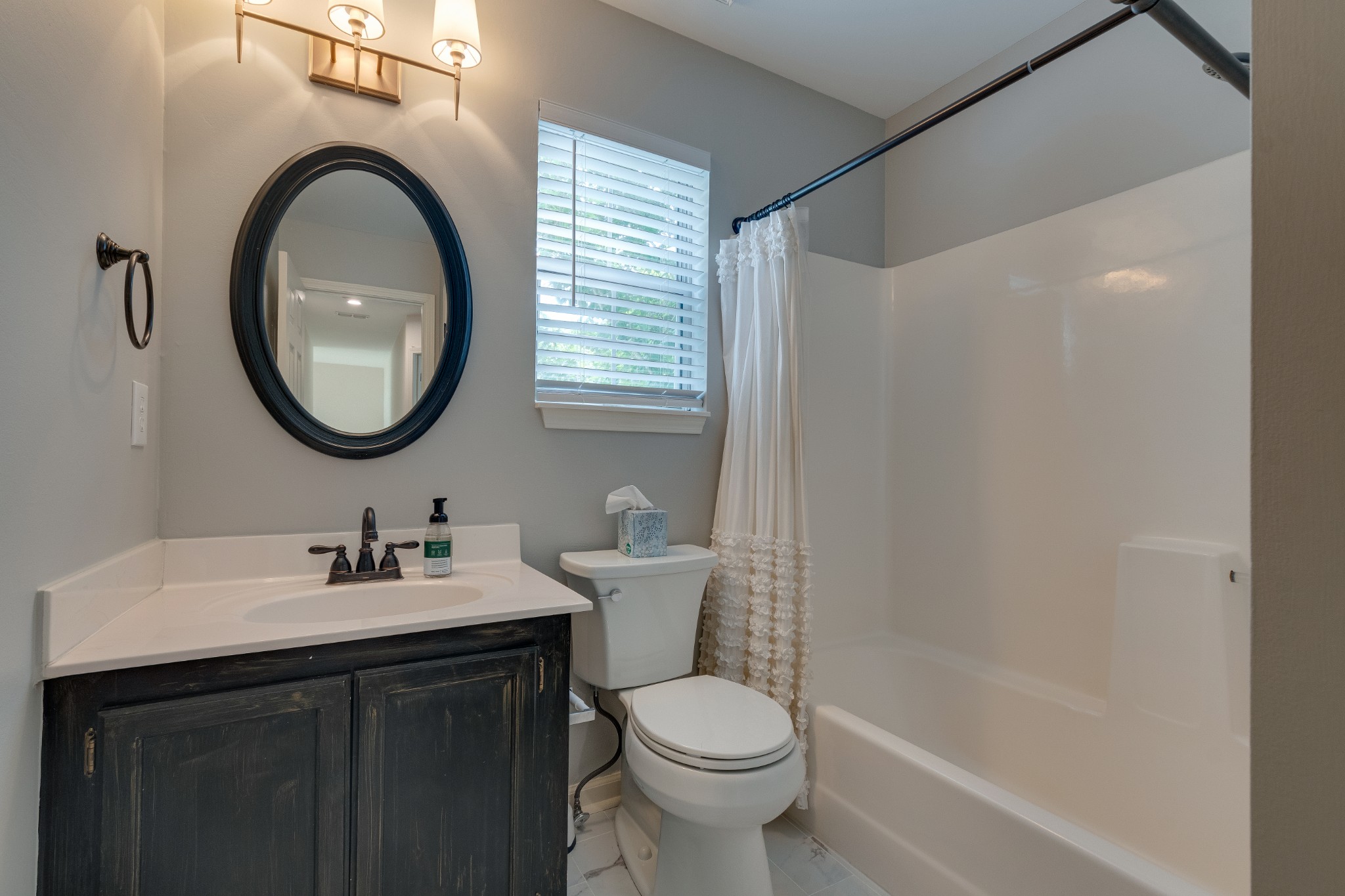 136 Cavalcade Circle Franklin, TN 37069 - Photo 20 of 31 a bathroom with a sink a toilet and a mirror