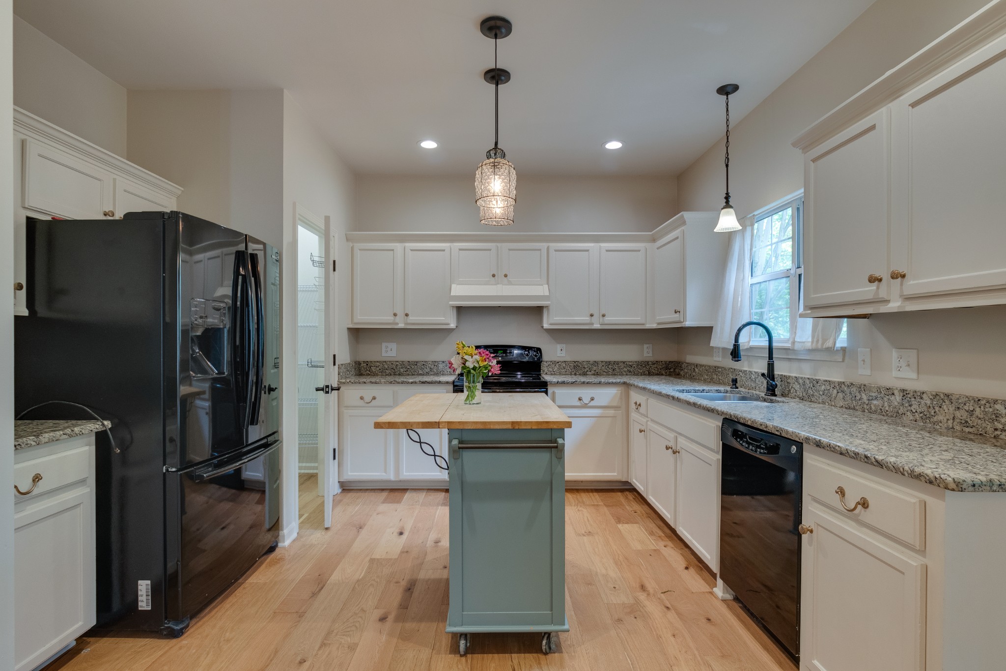 136 Cavalcade Circle Franklin, TN 37069 - Photo 10 of 31 a kitchen with kitchen island granite countertop stainless steel appliances cabinets a sink and a counter top space