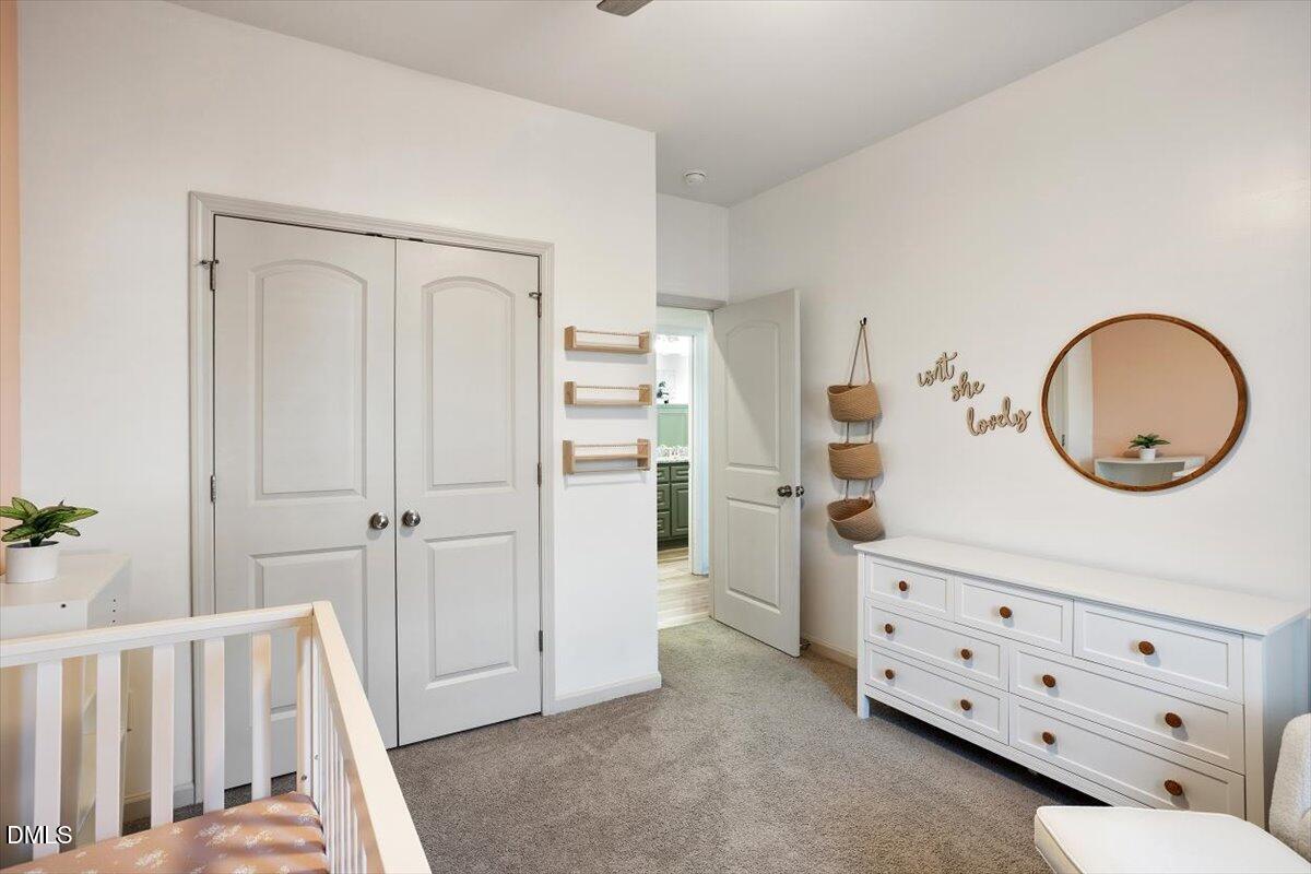 4045 Needham Road Bailey, NC 27807 - Photo 18 of 32 a view of a bedroom with baby crib and furniture