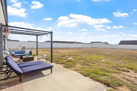 a sitting area with view of lake
