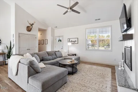 a living room with furniture and a flat screen tv