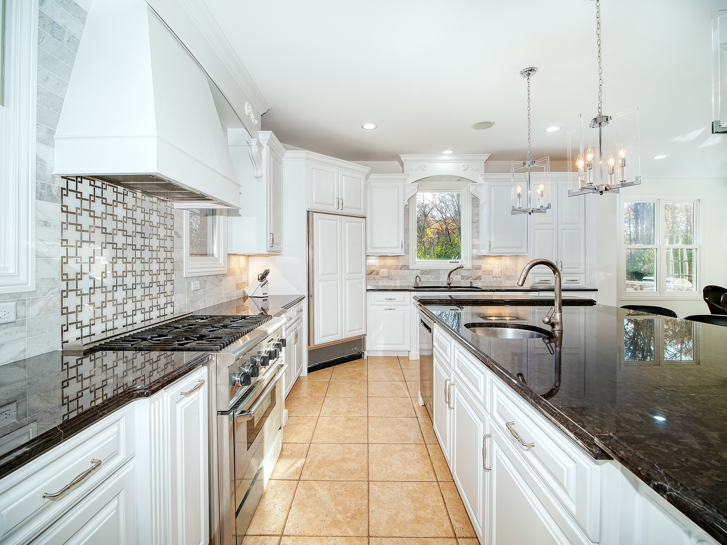 700 Timber Trail Riverwoods, IL 60015 - Photo 7 of 55 a kitchen with kitchen island granite countertop a sink stove and cabinets