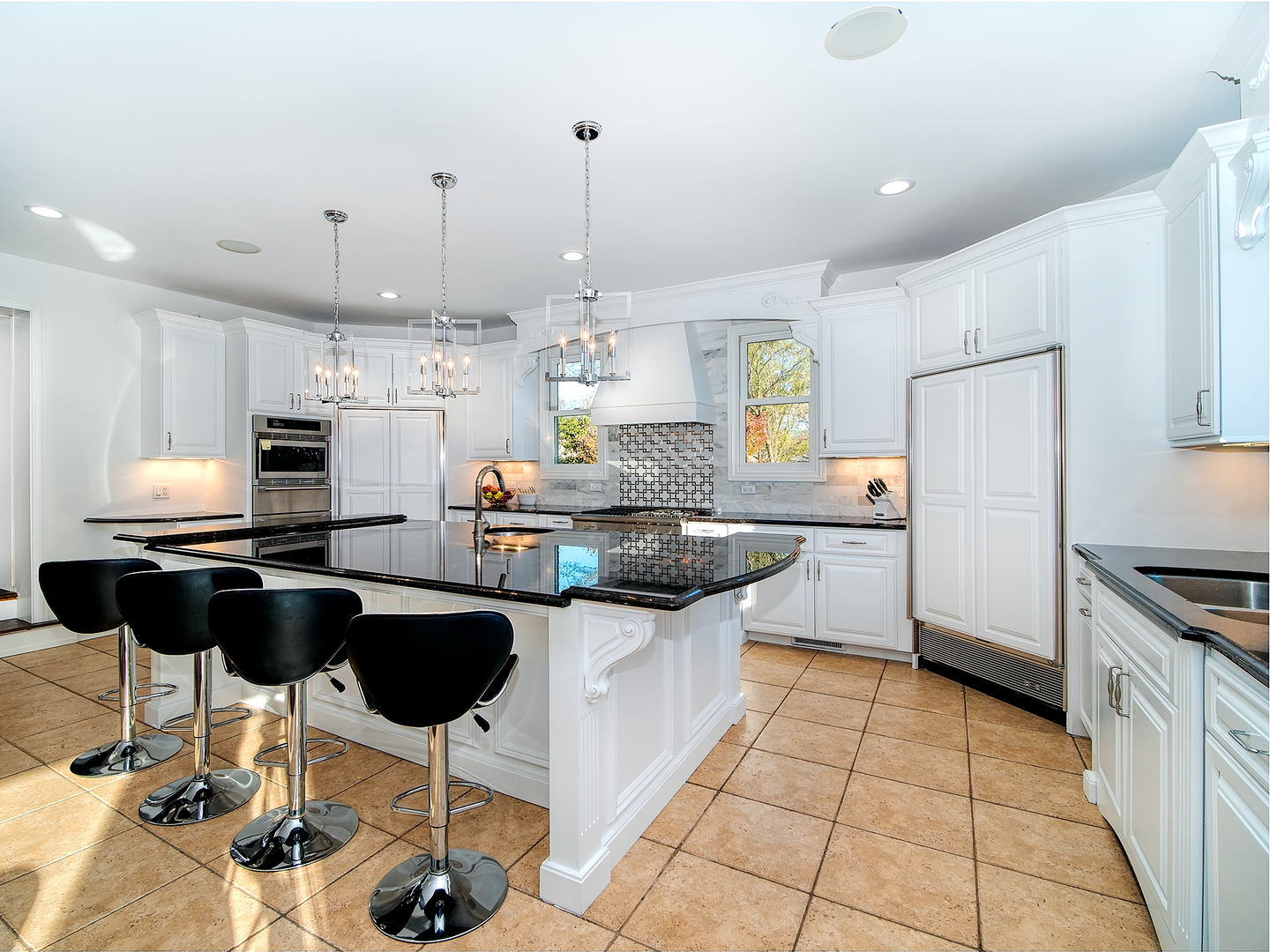 700 Timber Trail Riverwoods, IL 60015 - Photo 8 of 55 a kitchen with stainless steel appliances kitchen island granite countertop a sink and cabinets