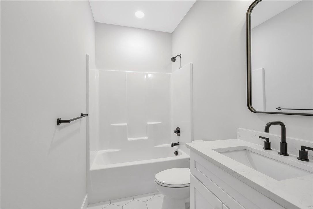4554 Flat Rock Road Iva, SC 29655 - Photo 20 of 32 A well-appointed bath boasts modern fixtures and pristine finishes for everyday comfort.