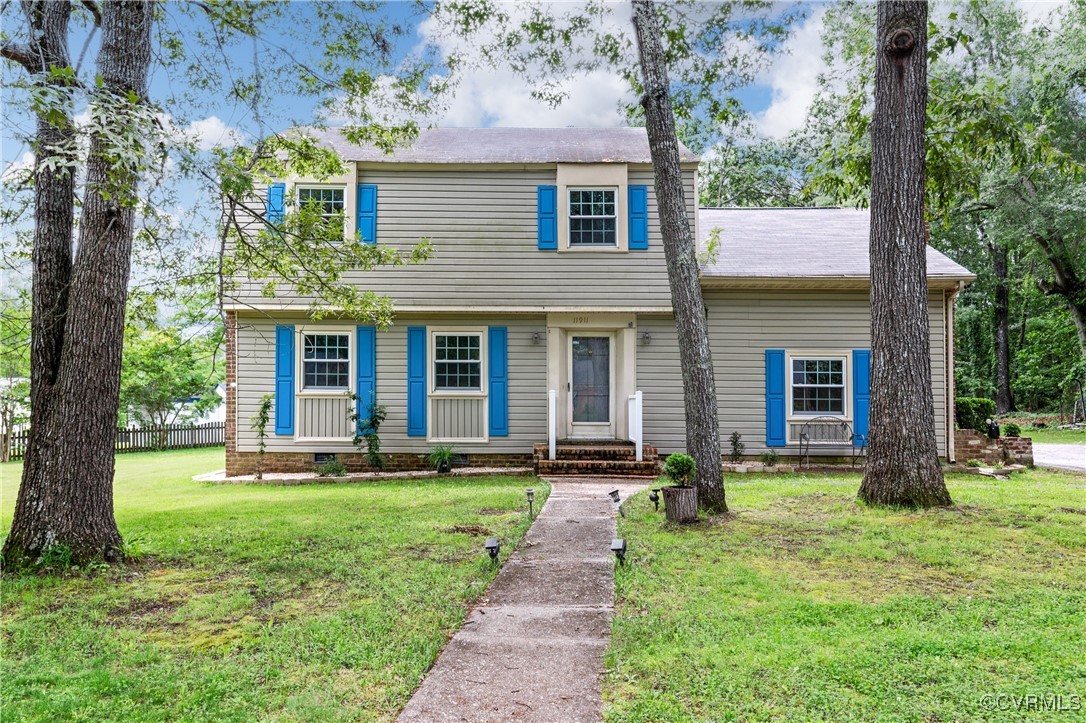 11911 Kilrenny Road Midlothian, VA 23113 - Photo 1 of 39 a front view of a house with a yard