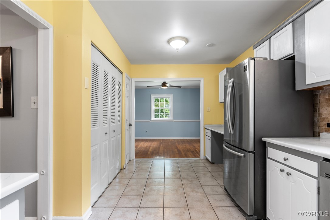 11911 Kilrenny Road Midlothian, VA 23113 - Photo 11 of 39 a kitchen with a refrigerator sink and cabinets