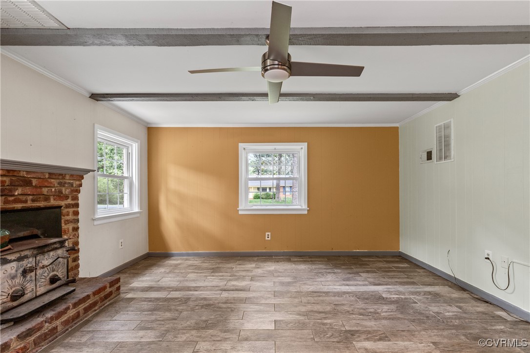 11911 Kilrenny Road Midlothian, VA 23113 - Photo 13 of 39 a view of a livingroom with an empty space and a fireplace