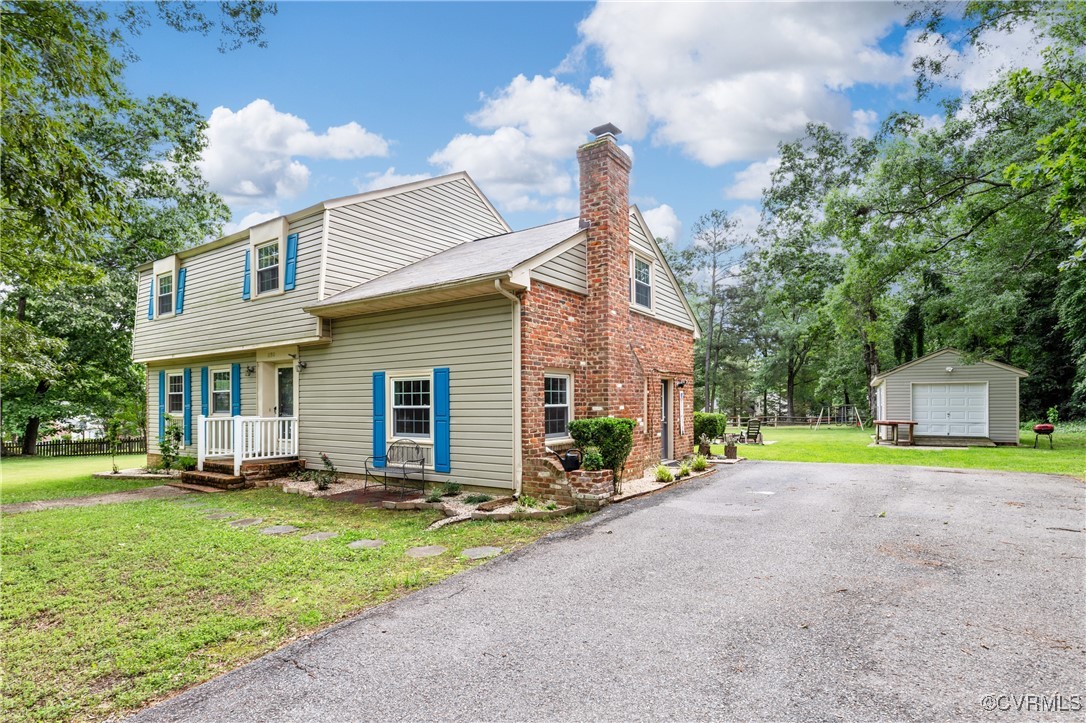 11911 Kilrenny Road Midlothian, VA 23113 - Photo 2 of 39 a front view of a house with a yard and trees