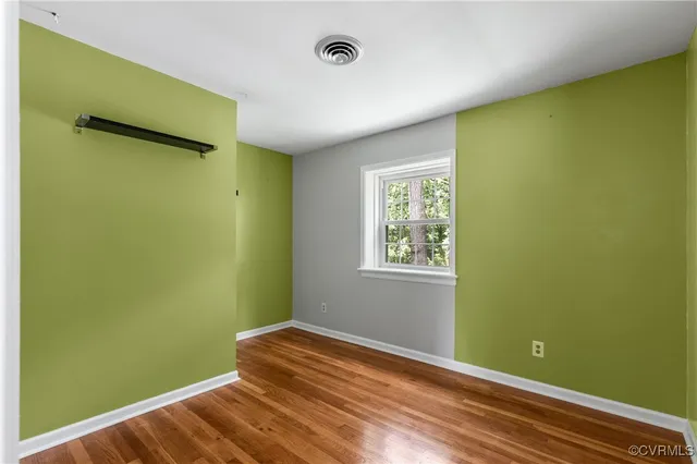 a room with a bed and a window