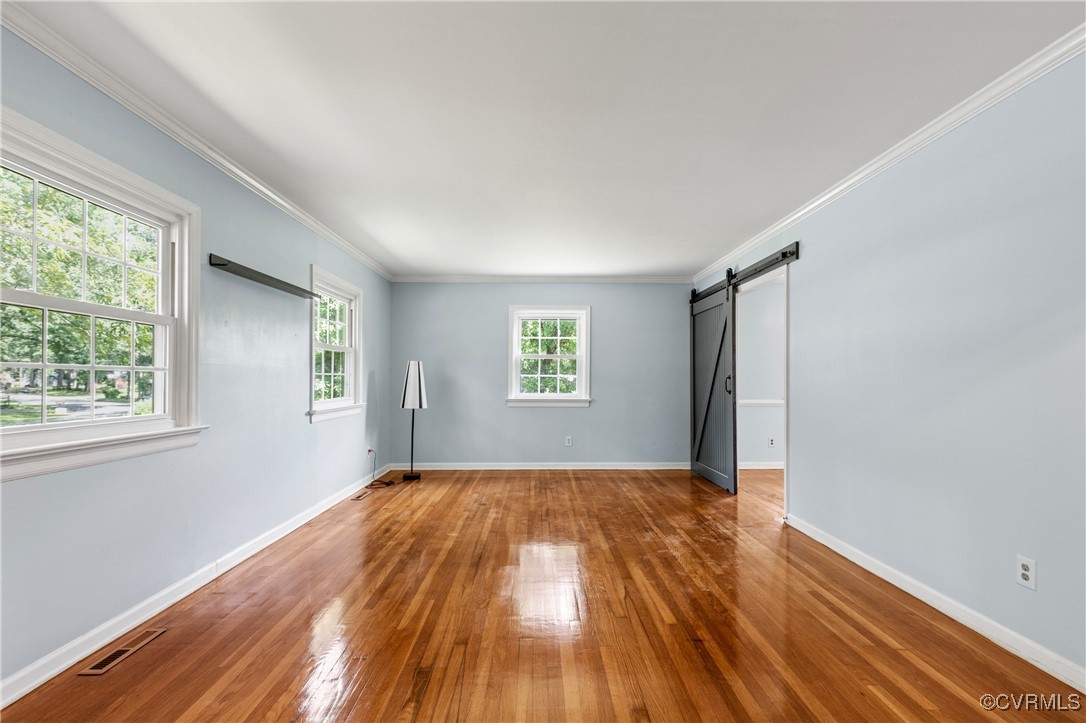 11911 Kilrenny Road Midlothian, VA 23113 - Photo 3 of 39 a view of empty room with wooden floor and fan