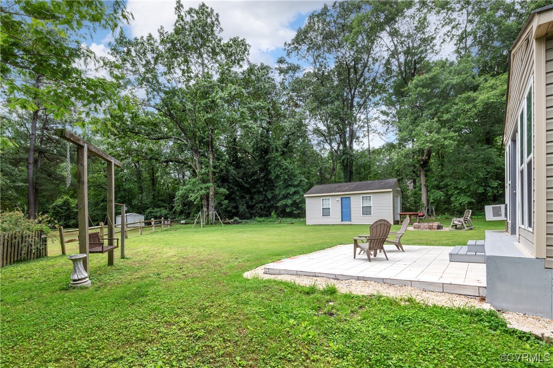 11911 Kilrenny Road Midlothian, VA 23113 - Photo 31 of 39 a view of a house with a backyard and a slide
