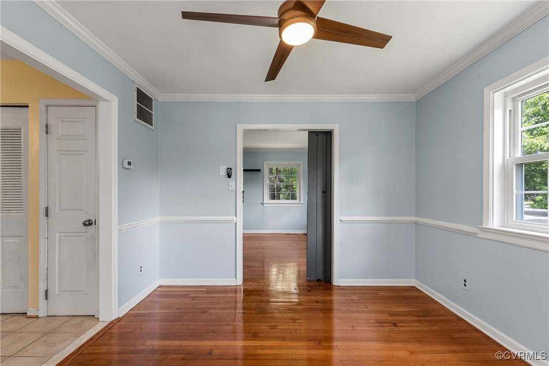 11911 Kilrenny Road Midlothian, VA 23113 - Photo 6 of 39 wooden floor in an empty room with a window