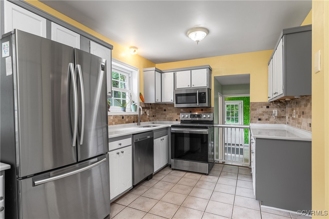 11911 Kilrenny Road Midlothian, VA 23113 - Photo 9 of 39 a kitchen with stainless steel appliances granite countertop a refrigerator sink and stove