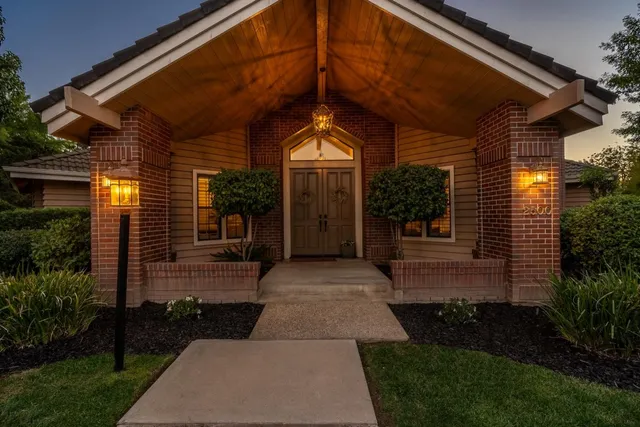 a front view of a house with garden