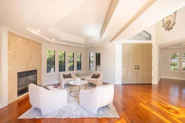 a view of empty room with wooden floor