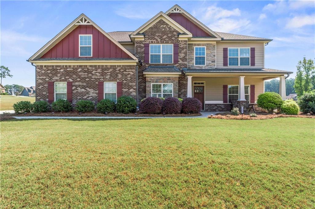 a front view of a house with garden