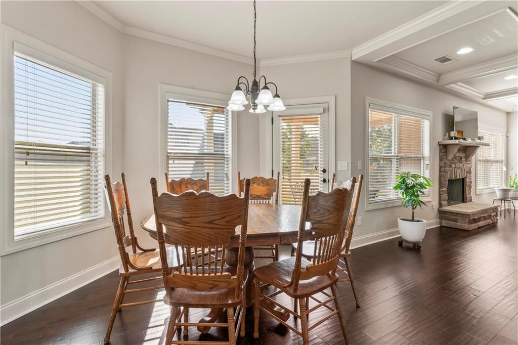 7004 Becca Lane Locust Grove, GA 30248 - Photo 12 of 39 a view of a dining room with furniture window and wooden floor
