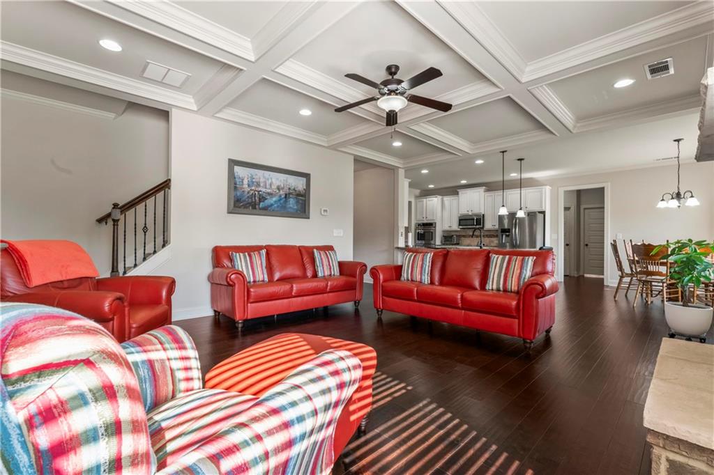 7004 Becca Lane Locust Grove, GA 30248 - Photo 15 of 39 a living room with furniture and a chandelier