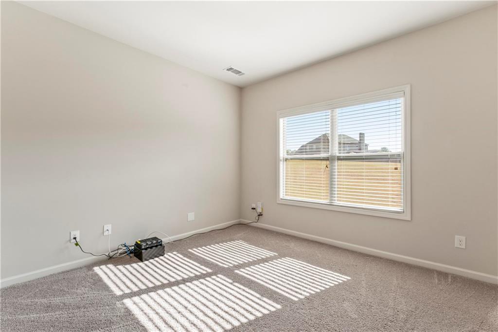 7004 Becca Lane Locust Grove, GA 30248 - Photo 17 of 39 a view of an empty room with a window