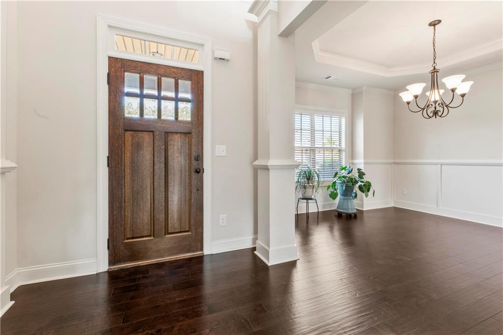 7004 Becca Lane Locust Grove, GA 30248 - Photo 2 of 39 an empty room with wooden floor and windows