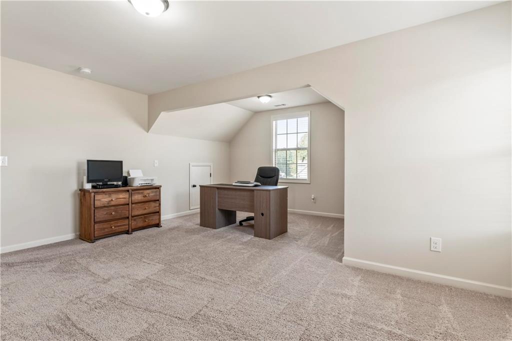 7004 Becca Lane Locust Grove, GA 30248 - Photo 24 of 39 a room with furniture and a window