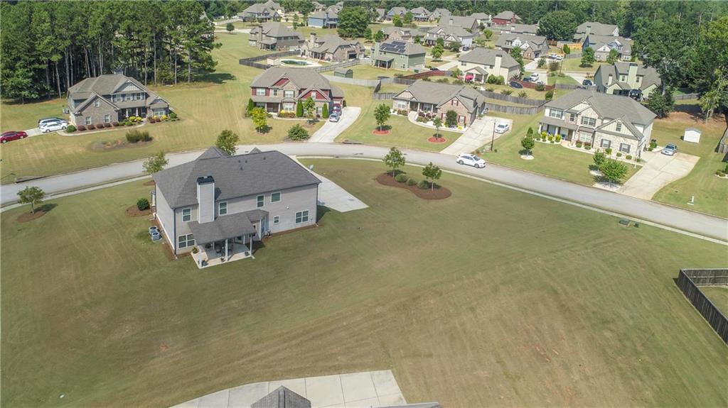 7004 Becca Lane Locust Grove, GA 30248 - Photo 34 of 39 an aerial view of a house with a swimming pool