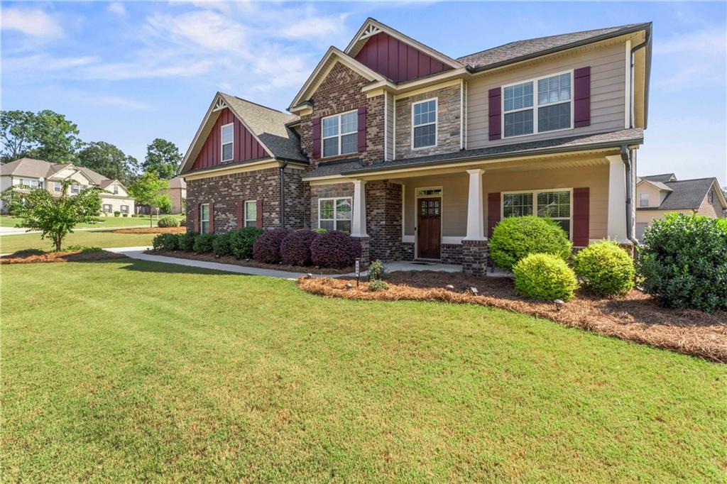 7004 Becca Lane Locust Grove, GA 30248 - Photo 36 of 39 a front view of house with yard and swimming pool
