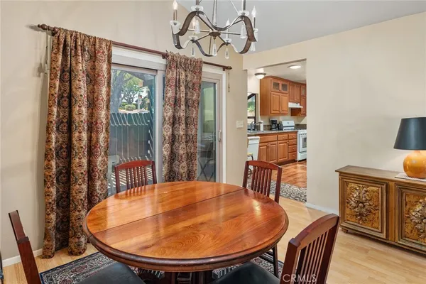 a large kitchen with a table and chairs
