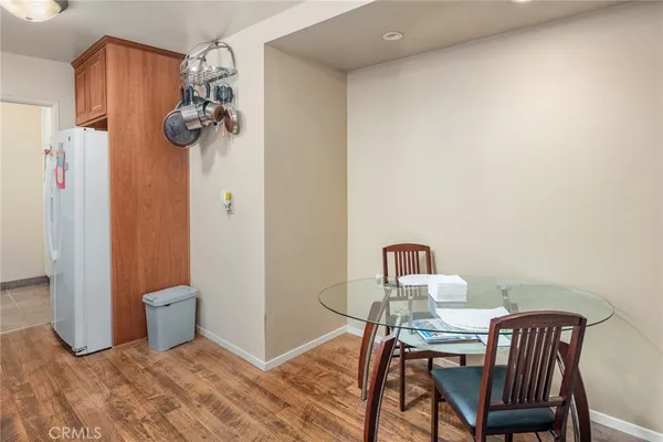 a view of a kitchen tables and chairs in it