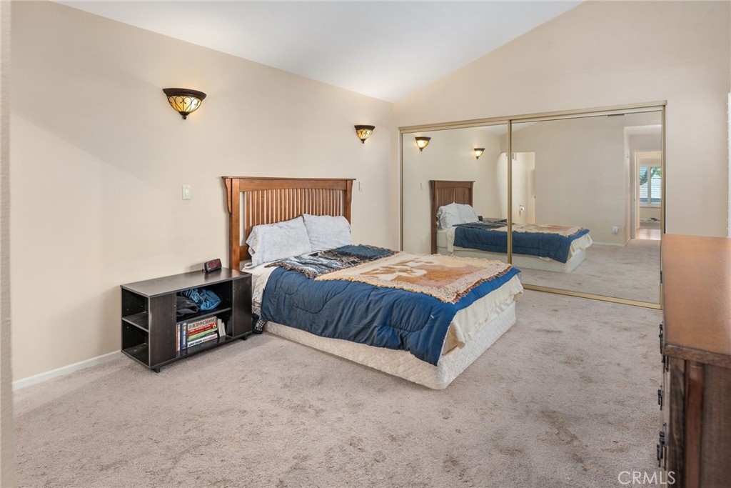 1400 Market Street Vista, CA 92084 - Photo 17 of 31 a bed room with a bed and a couch
