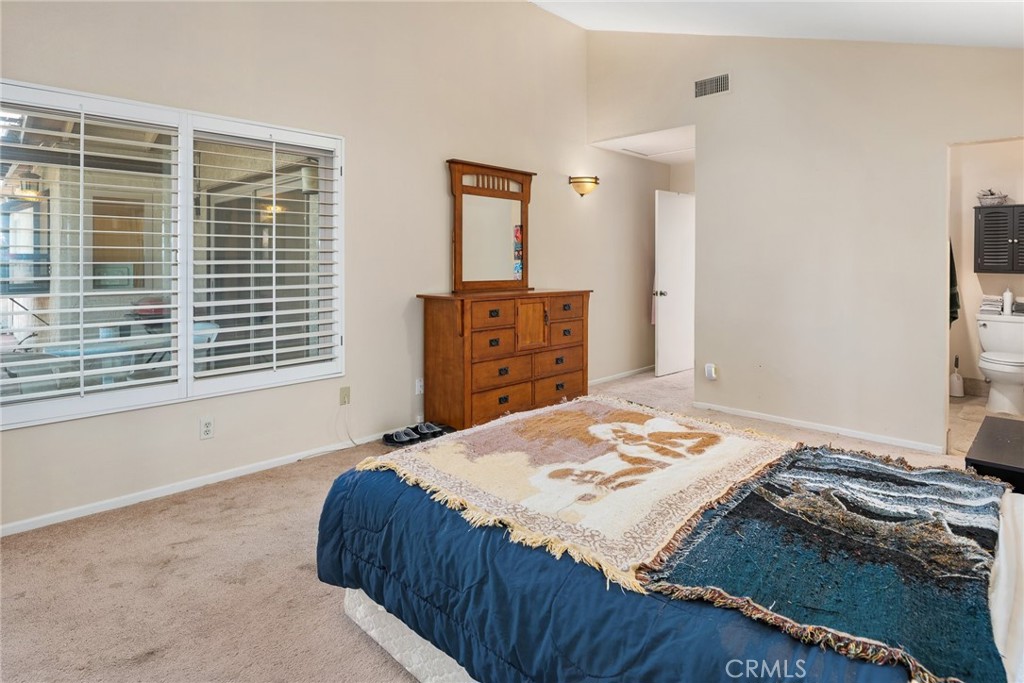 1400 Market Street Vista, CA 92084 - Photo 18 of 31 a bedroom with a bed and a window