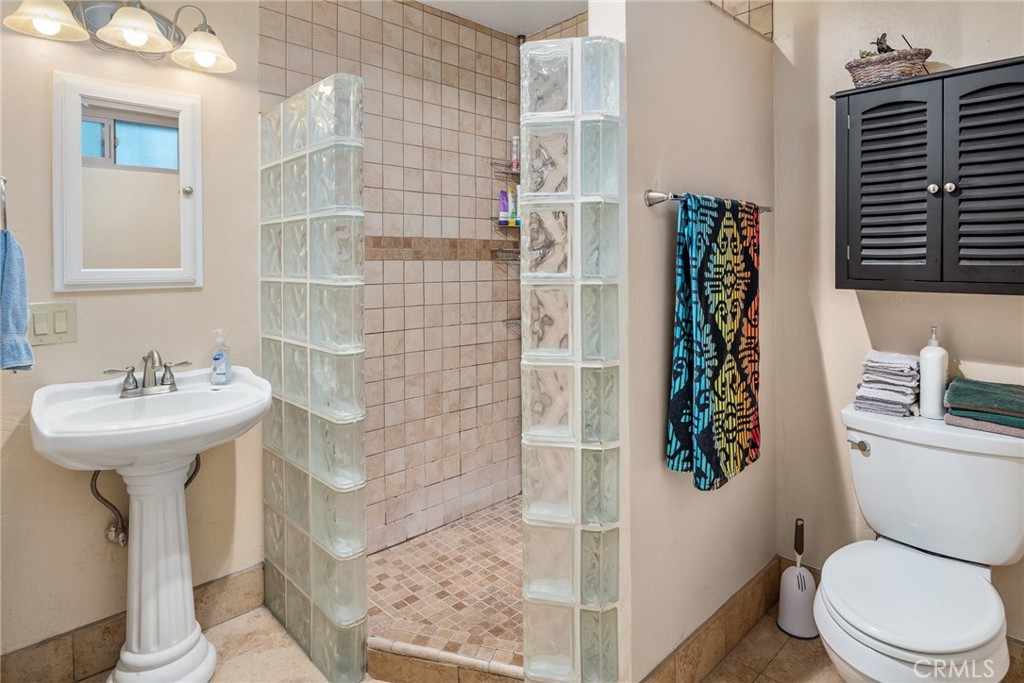 1400 Market Street Vista, CA 92084 - Photo 19 of 31 a bathroom with a sink toilet and shower