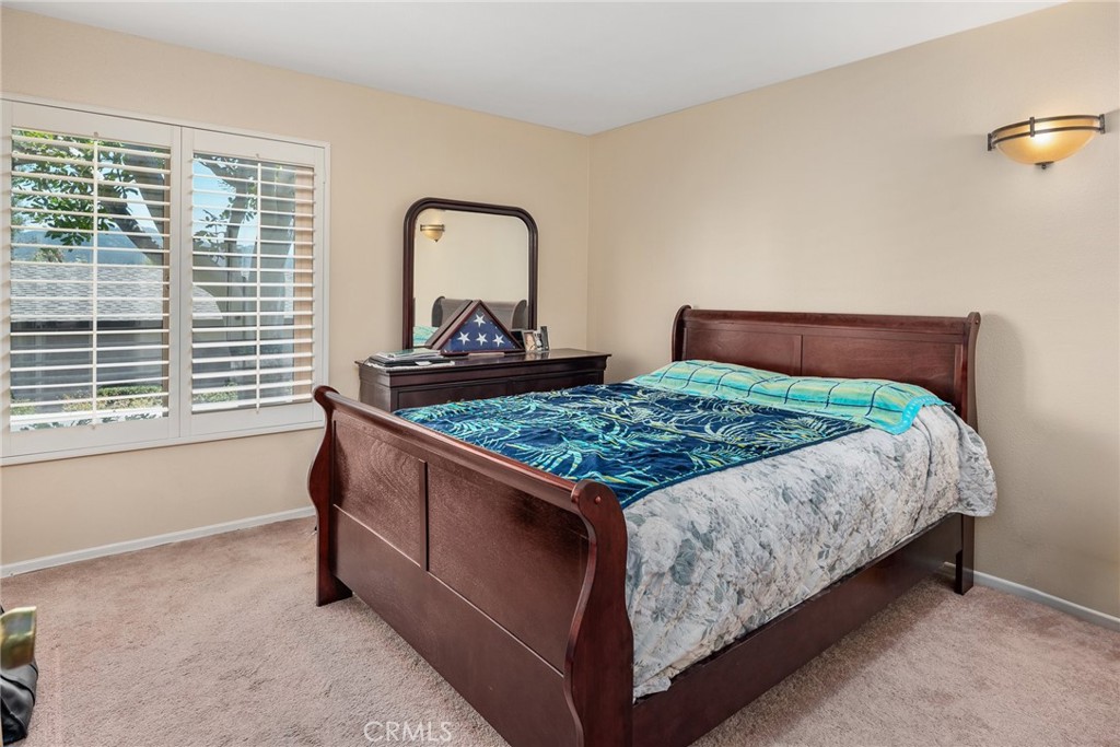 1400 Market Street Vista, CA 92084 - Photo 20 of 31 a bed sitting in a bedroom next to a window