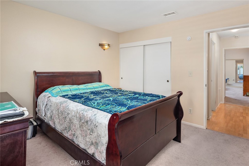 1400 Market Street Vista, CA 92084 - Photo 21 of 31 a bedroom with a bed and window