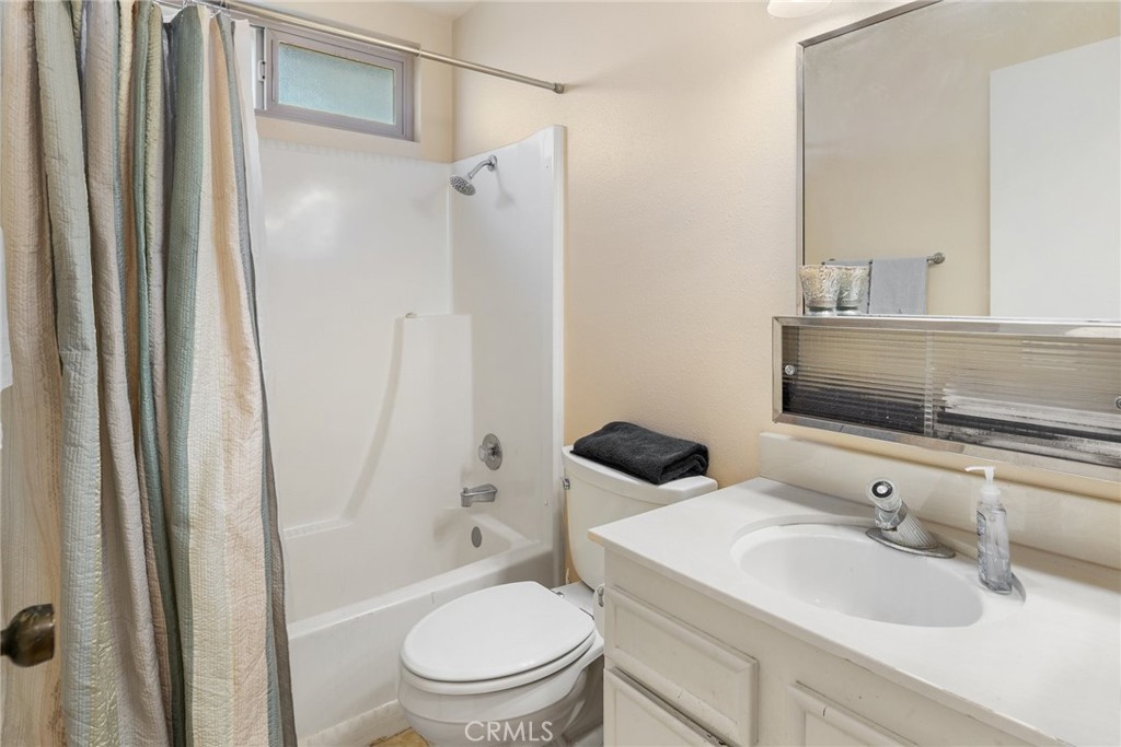 1400 Market Street Vista, CA 92084 - Photo 22 of 31 a bathroom with a sink toilet and shower